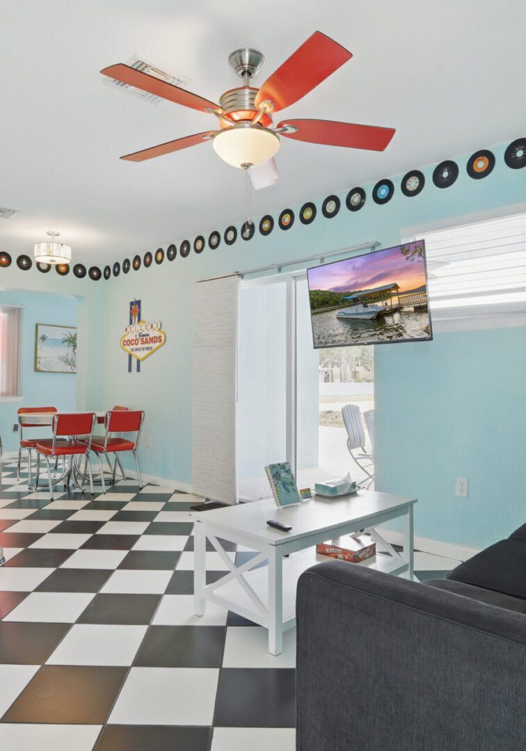 Retro-style living room with checkerboard floor and vinyl records decor.
